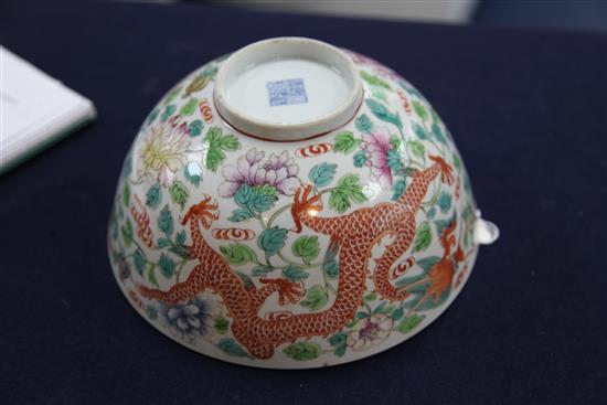 A Chinese famille rose dragon and phoenix bowl, Jiaqing seal mark, late 19th / early 20th century, diam. 21cm, broken and repaired